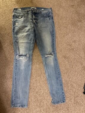 Passing distressed blue jeans